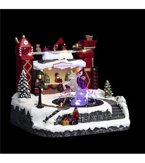Pueblo navideño iluminado, fuente del taller de Papá Noel